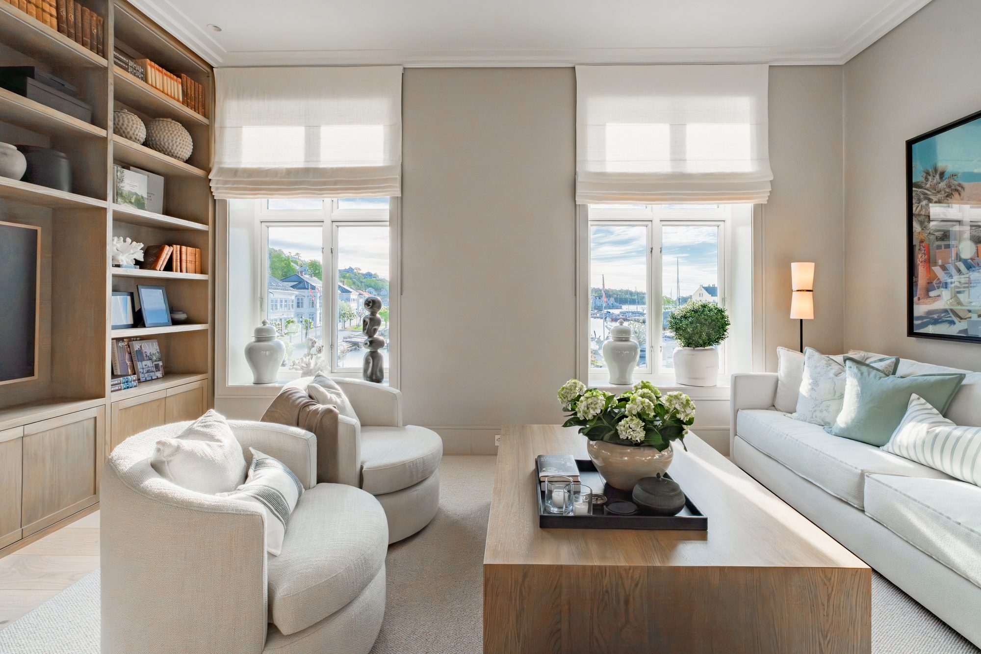 Living room with bookshelves and harbour view